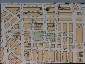 Rectangular box with Map of Greenwich Village paper, closeup view of top