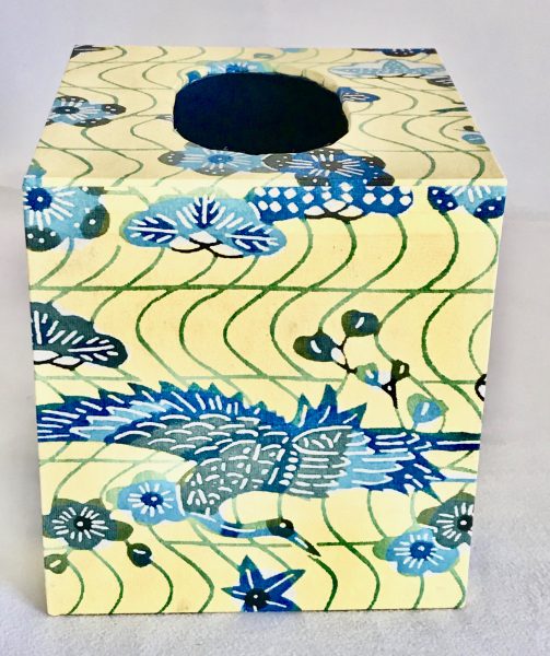 Tissue box cover with blue phoenix and blue flowers on yellow Japanese paper.